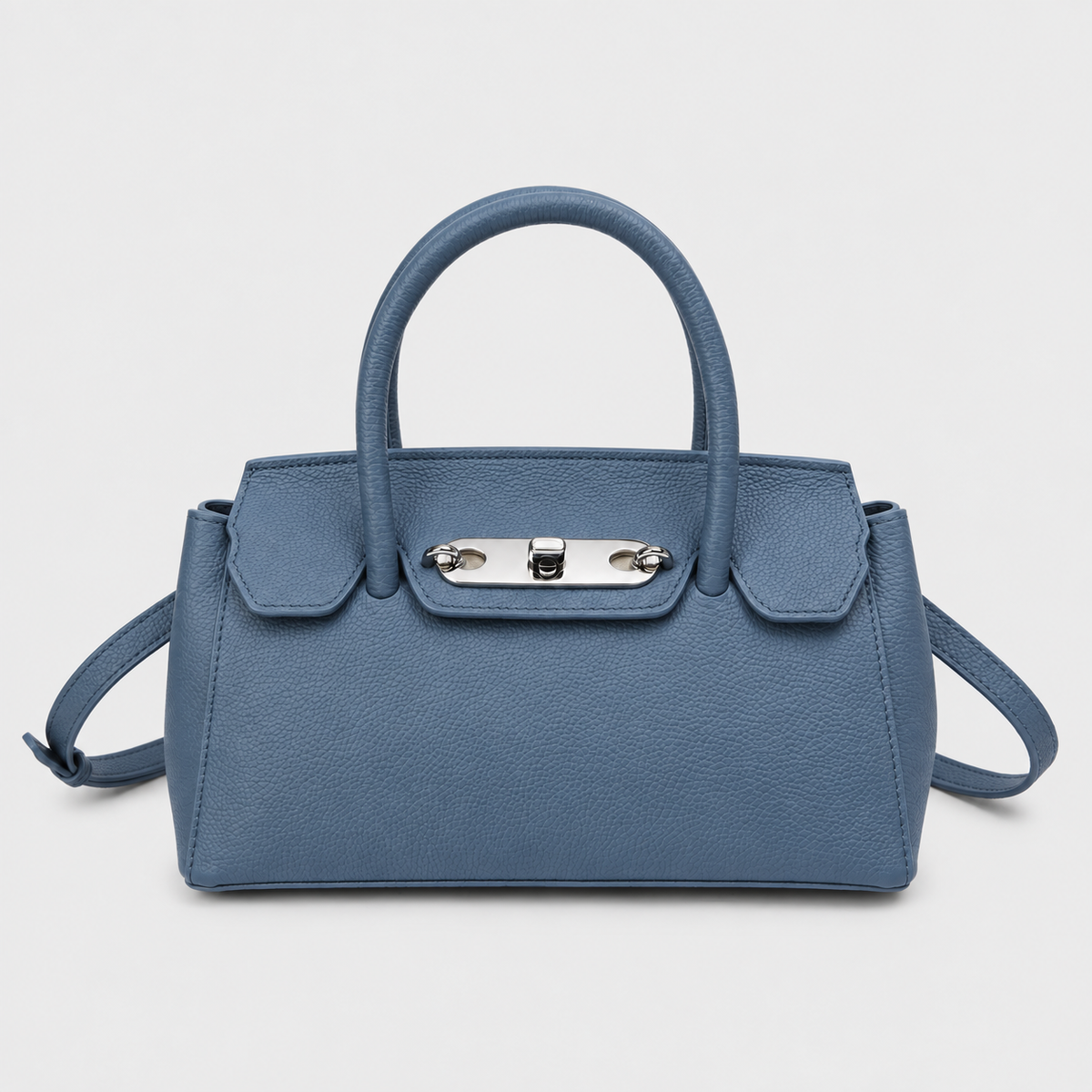 VALENORA Lorraine shoulder bag in agate blue genuine leather with a structured boxy shape and silver lock-buckle.