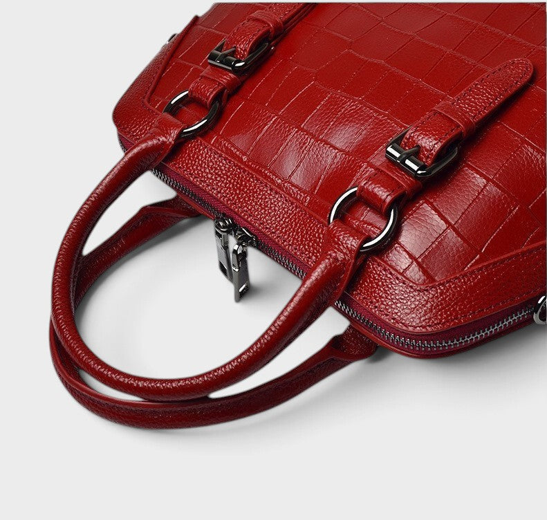 VALENORA Lucienne wine red genuine leather handbag with a structured crocodile-embossed texture and metal buckles.