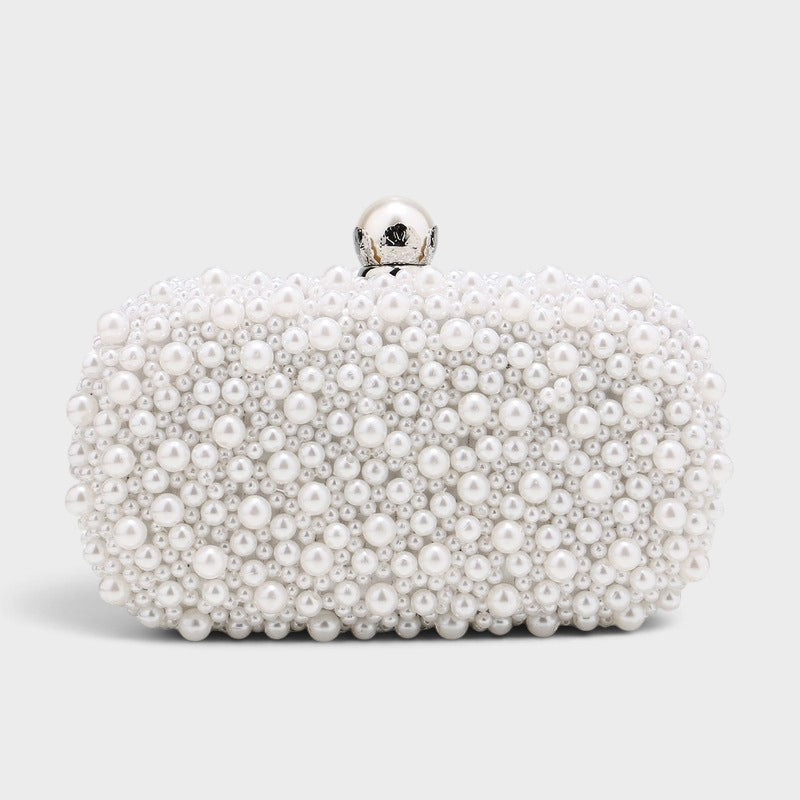 VALENORA Luna pearl clutch with a pearlescent finish and a silver clasp, perfect for elegant evening wear.