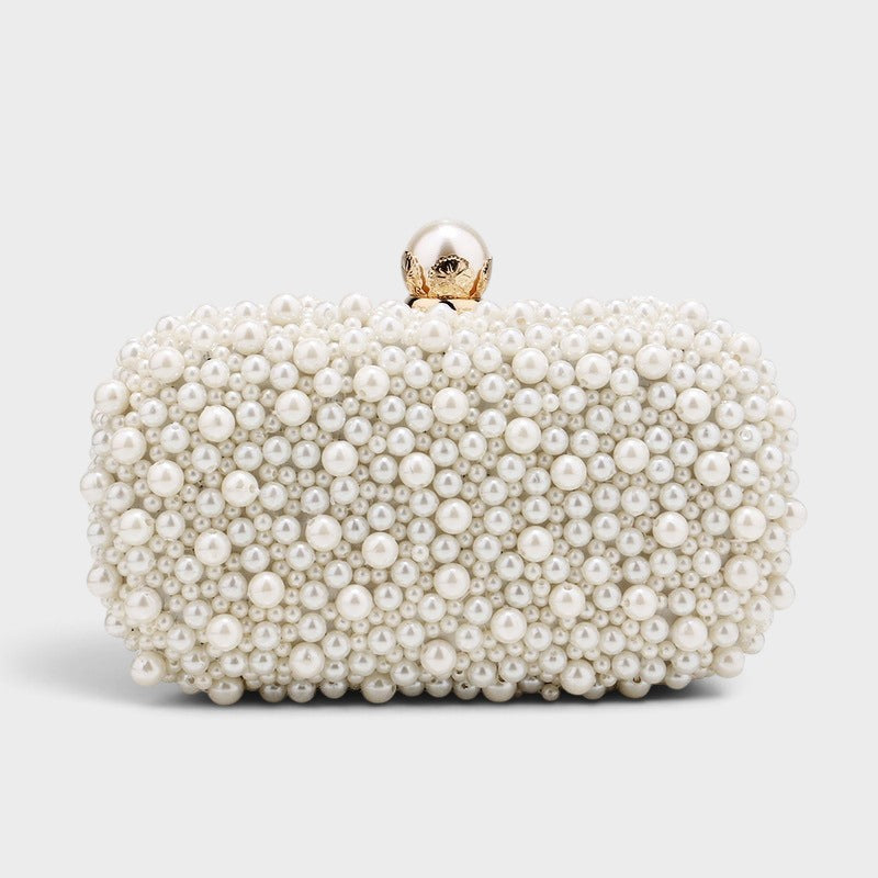 VALENORA Luna pearl clutch with a pearlescent finish and a decorative gold-toned clasp on a neutral background.