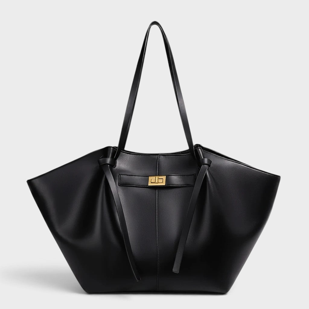 VALENORA Madison black leather tote bag with a sculptural knotted top handle and gold-tone hardware clasp.
