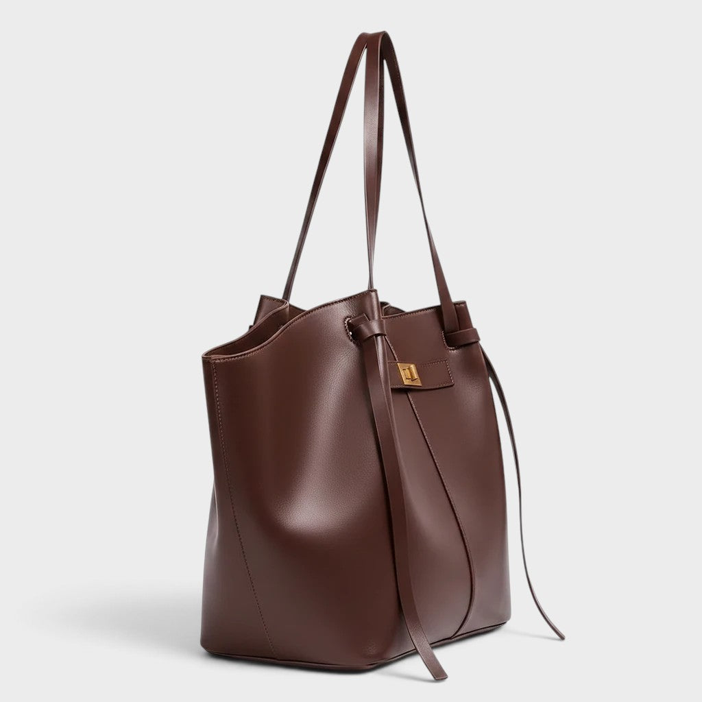 VALENORA Madison leather tote bag in deep burgundy with a sculptural knotted top handle and gold hardware.
