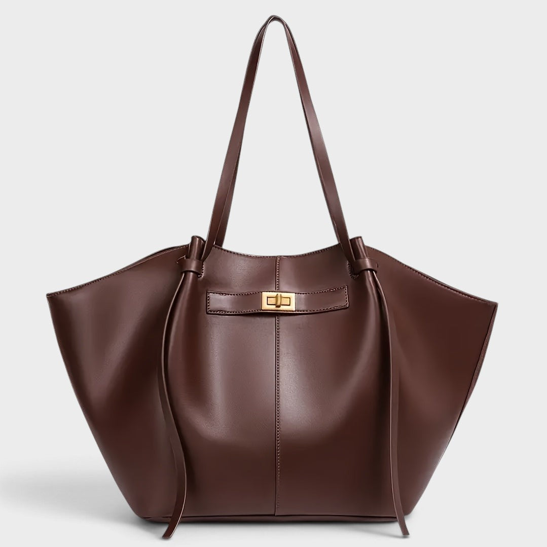 VALENORA Madison leather tote bag in deep burgundy with a sculptural knotted handle and gold-tone hardware.