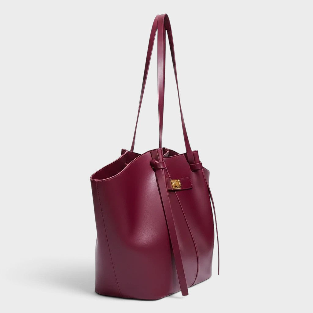 VALENORA Madison burgundy leather tote bag with a sculptural knotted top handle and gold hardware side view