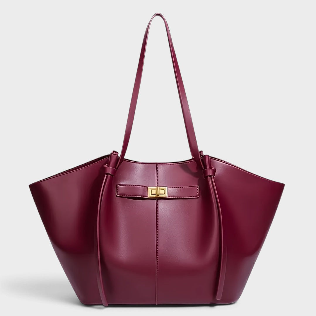 VALENORA Madison burgundy leather tote bag with a sculptural knotted top handle and gold-tone metal clasp closure.