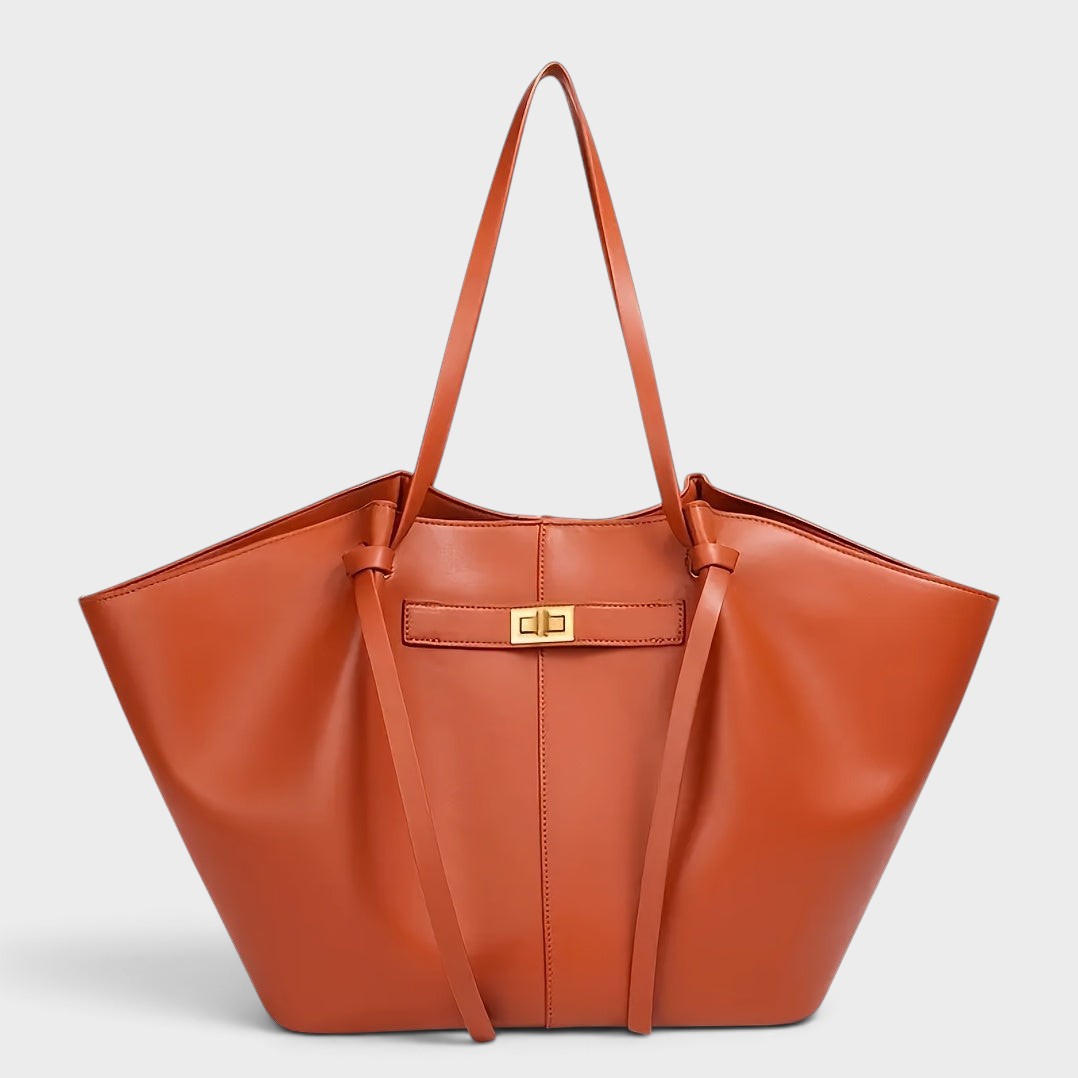 VALENORA Madison leather tote bag in cognac brown with a sculptural knotted top handle and gold-tone hardware.