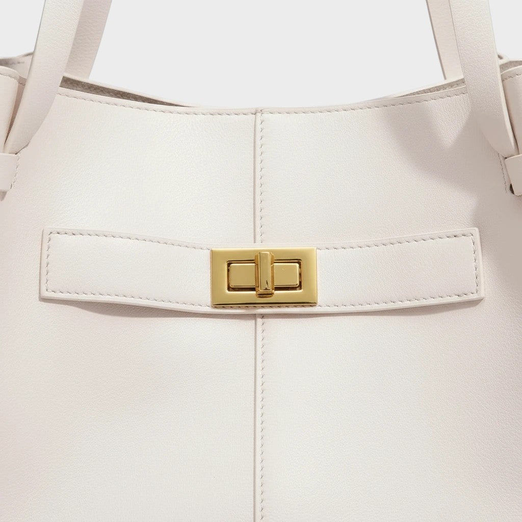 VALENORA Madison white leather tote bag featuring a polished gold-tone metal turn-lock closure detail.
