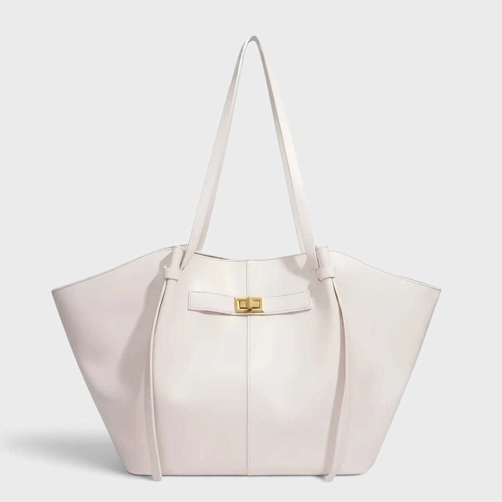 VALENORA Madison white leather tote bag with a sculptural knotted handle and gold hardware clasp
