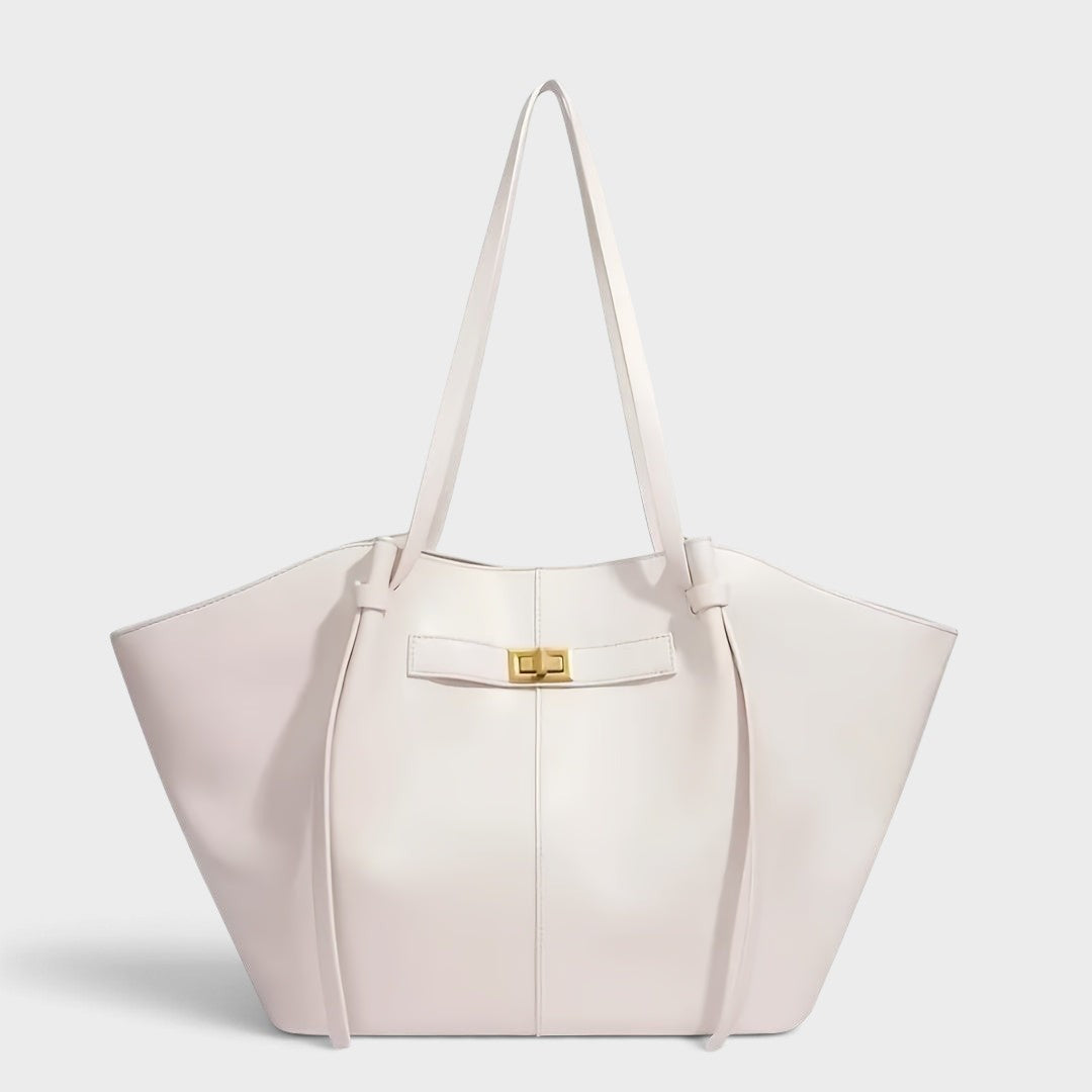 VALENORA Madison white leather tote bag with a sculptural knotted handle and gold hardware detail