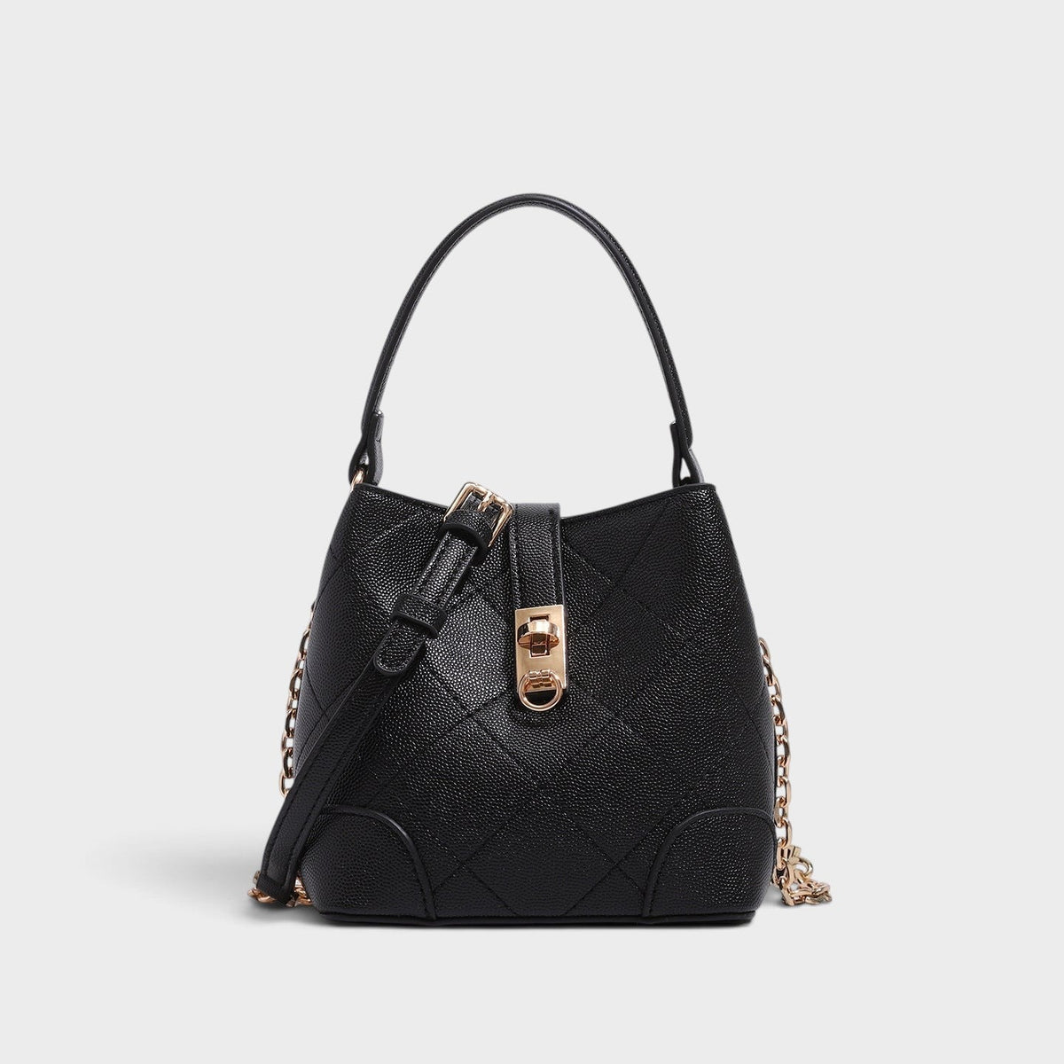 VALENORA Margot black vegan leather bucket bag with quilted diamond texture, gold turn-lock, and side chain detail.
