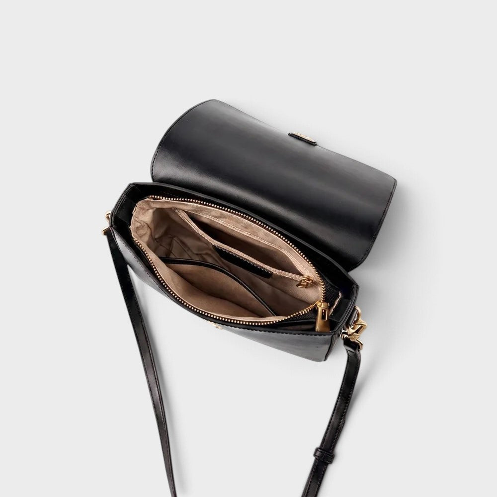VALENORA Marisa black leather shoulder bag with open flap showing interior pockets and gold-tone hardware details.