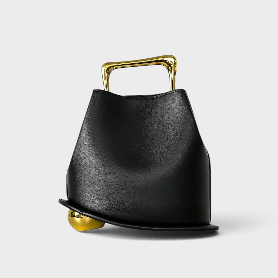VALENORA Marisol black sculptural handbag with a polished gold-toned handle and spherical base detail.