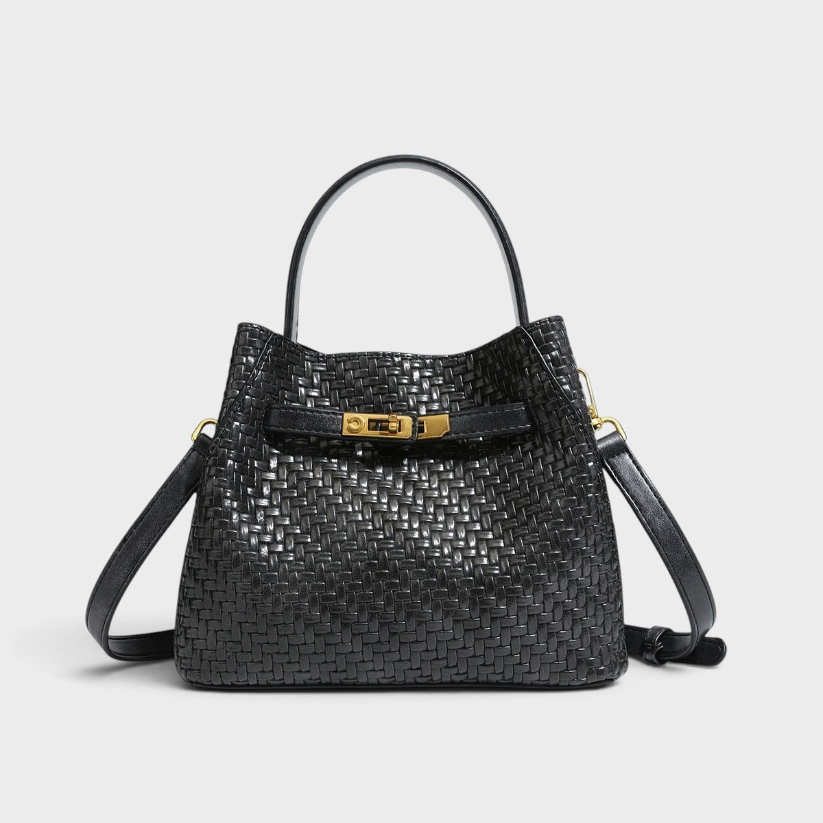 VALENORA Miranda black woven leather shoulder bag with a structured silhouette, top handle, and gold buckle hardware.
