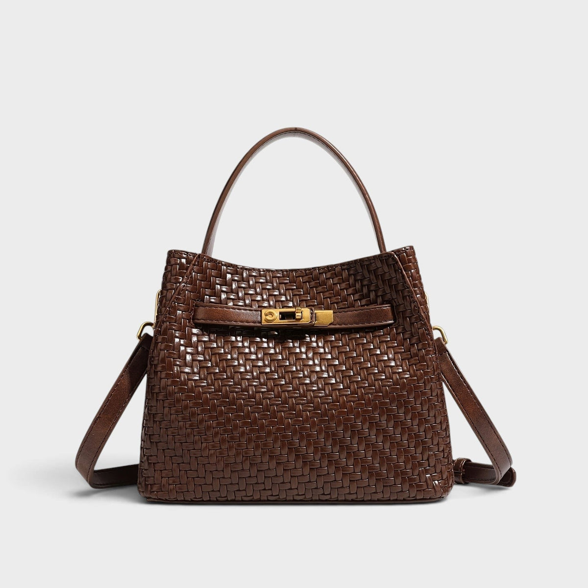 VALENORA Miranda brown woven leather shoulder bag with gold hardware, top handle, and adjustable crossbody strap.