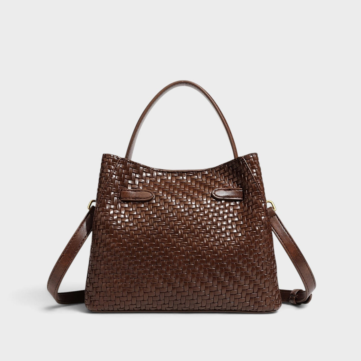 VALENORA Miranda brown woven leather shoulder bag with a structured silhouette, top handle, and gold hardware.
