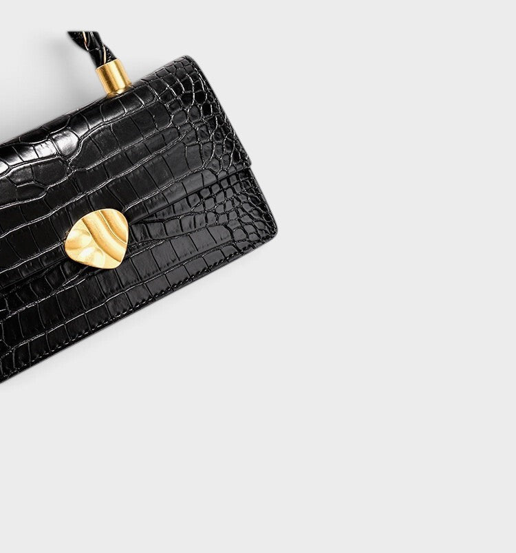 VALENORA Nancy black shoulder bag in croc-embossed cowhide leather with a gold-toned hardware accent.