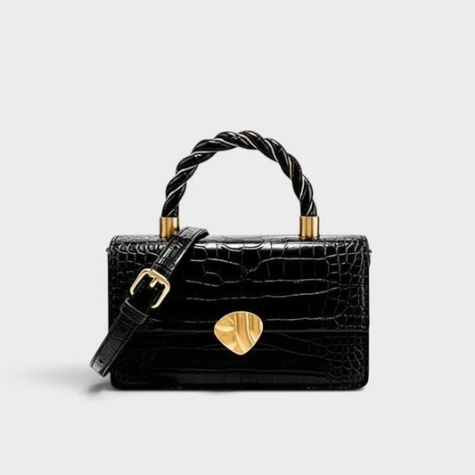 VALENORA Nancy black shoulder bag in croc-embossed cowhide leather with a twisted handle and gold hardware.
