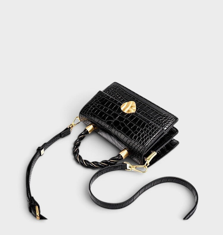 VALENORA Nancy black shoulder bag in croc-embossed cowhide leather with a braided handle and gold-tone hardware.