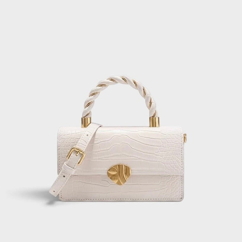 VALENORA Nancy white shoulder bag in croc-embossed cowhide leather with a twisted top handle and gold hardware.