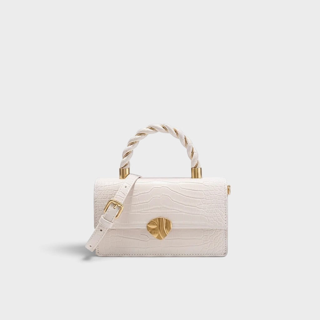 VALENORA Nancy white shoulder bag in croc-embossed cowhide leather with a twisted top handle and gold hardware.
