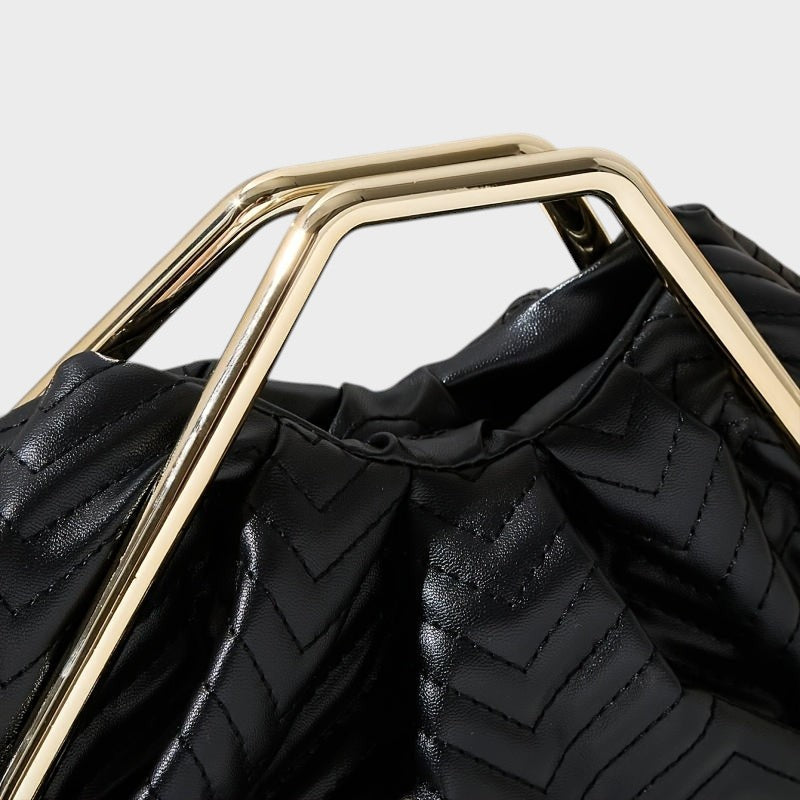 VALENORA Norah handbag in black vegan leather with a quilted herringbone pattern and gold-tone metal frame handles.