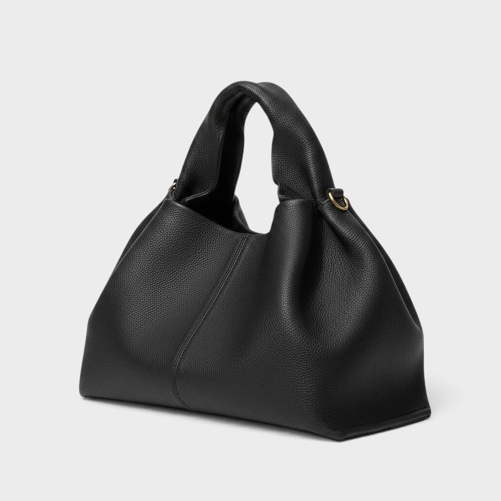 VALENORA Nova black vegan leather tote bag with a pebbled texture and structured silhouette.