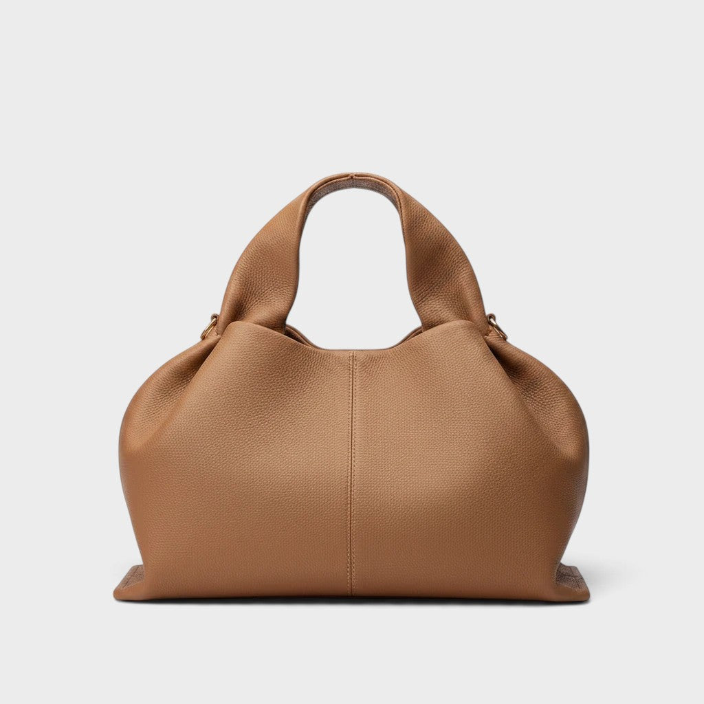 VALENORA Nova camel genuine leather handbag with a spacious, soft-structured design and comfortable top handles.