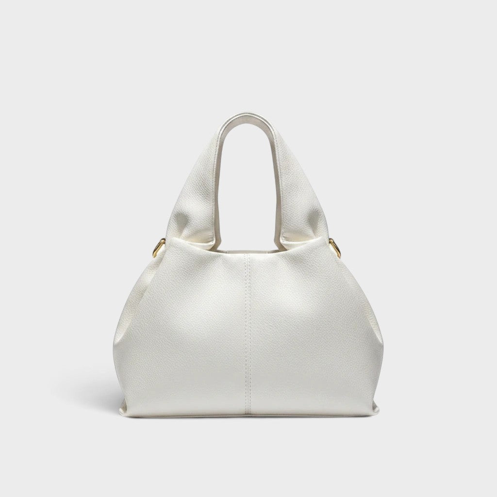 VALENORA Nova white genuine leather handbag with a spacious design and gold hardware details.