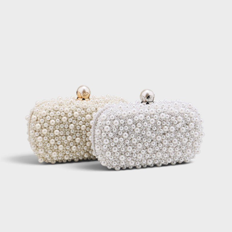 VALENORA Luna Pearl Clutch bags in white and cream with beaded texture and elegant clasp detail for evening wear.