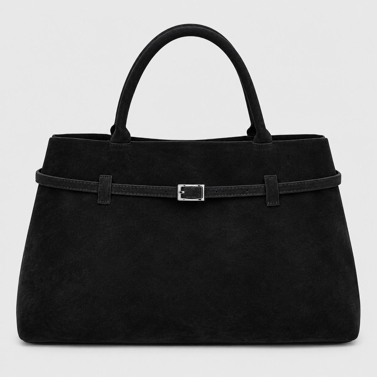 VALENORA Ramona black suede tote bag with a structured trapezoidal shape and a decorative silver buckle belt strap.