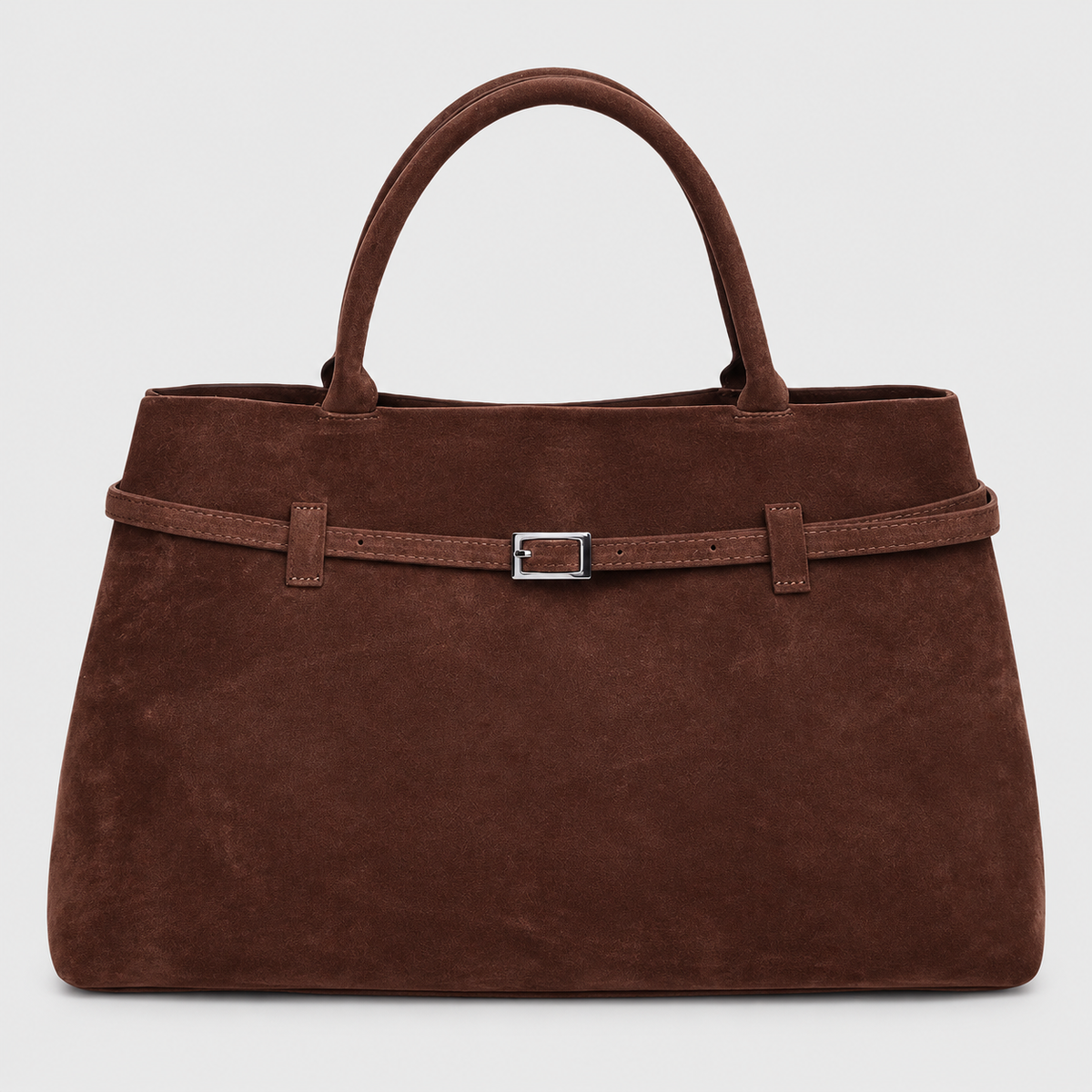 VALENORA Ramona coffee brown suede tote bag with a structured trapezoidal shape and a decorative silver buckle belt.