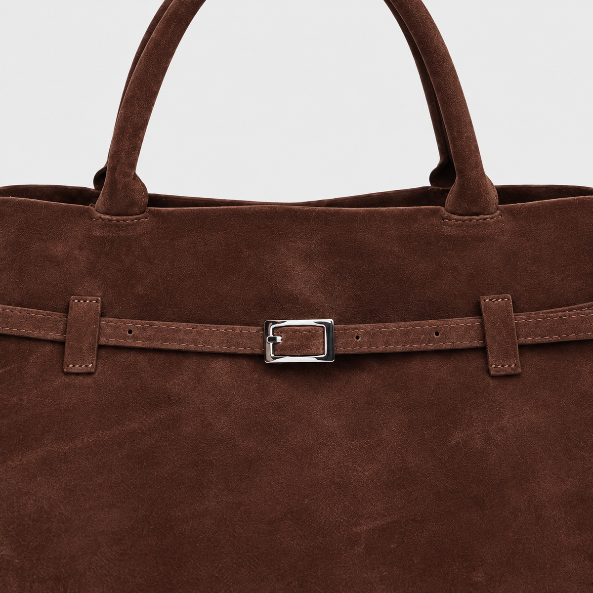 VALENORA Ramona coffee brown suede tote bag featuring a decorative slim belt strap with a polished silver buckle.