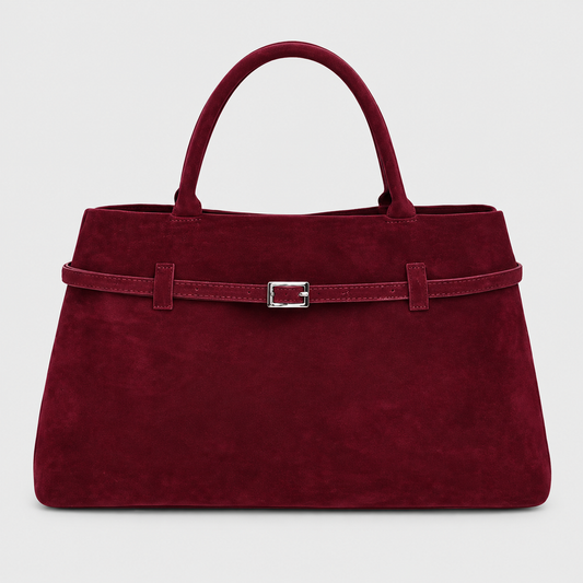 VALENORA Ramona wine red suede tote bag with a structured trapezoidal shape and a decorative silver buckle belt.