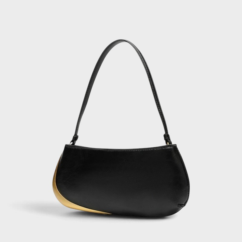 VALENORA Rosanna shoulder bag in black with a sleek curved silhouette and striking metallic gold side accent.