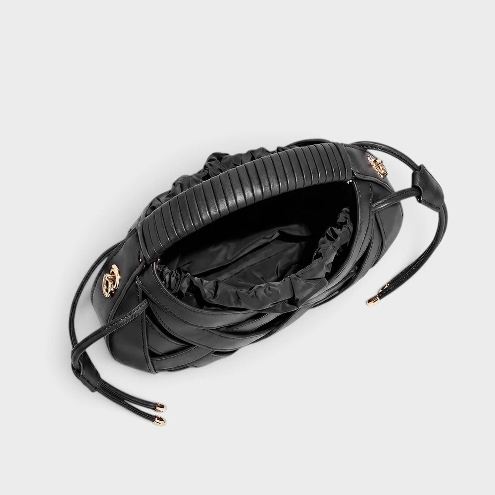 VALENORA Ruby black vegan leather handbag with a structured lattice overlay and a soft drawstring pouch interior.