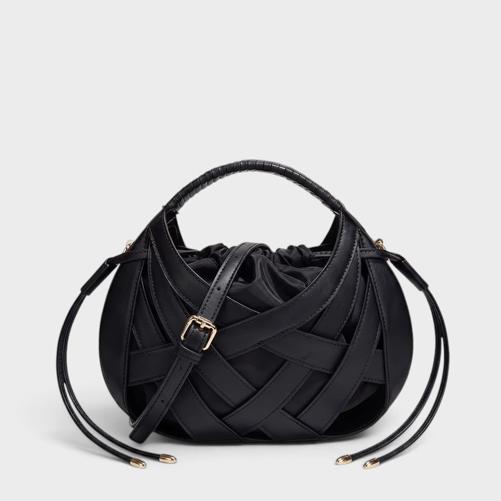 VALENORA Ruby black vegan leather handbag featuring a structured lattice overlay and a soft drawstring pouch interior.