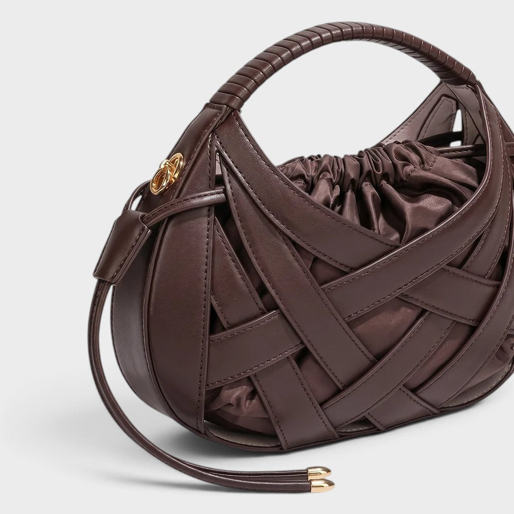 VALENORA Ruby handbag in dark brown vegan leather with an architectural lattice overlay and drawstring pouch interior.