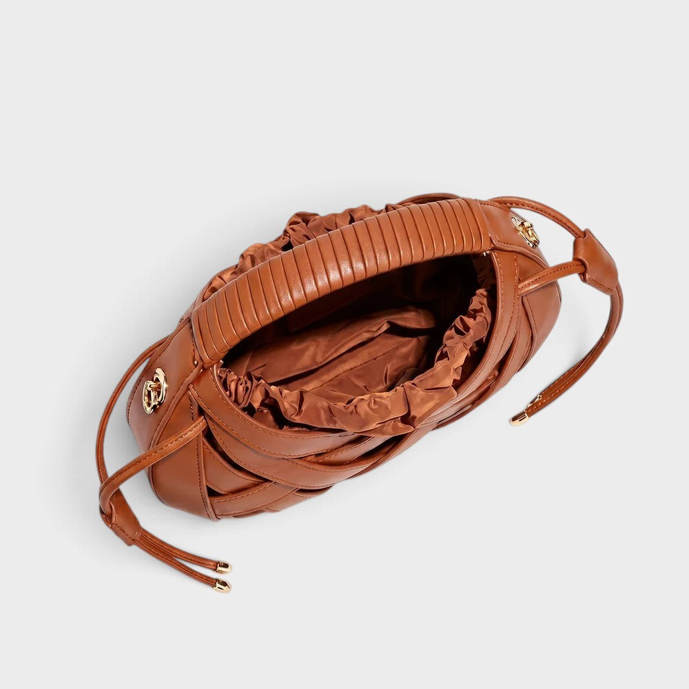 VALENORA Ruby brown vegan leather handbag with architectural lattice overlay and a comfortable wrapped handle.