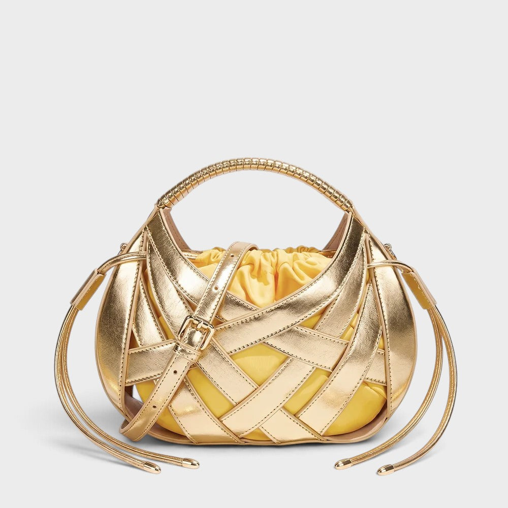 VALENORA Ruby handbag in metallic gold vegan leather with a structured lattice overlay and yellow drawstring pouch.