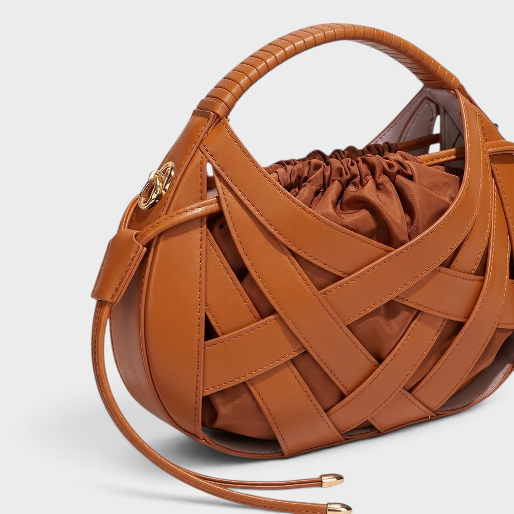VALENORA Ruby handbag in tan vegan leather featuring an architectural lattice overlay and a soft drawstring pouch.