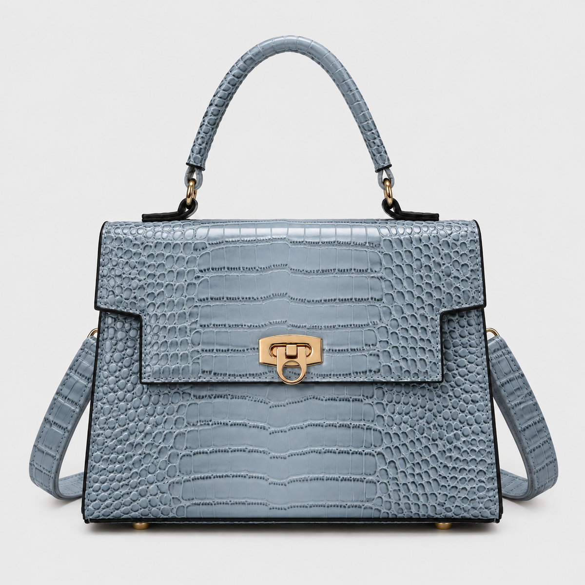 VALENORA Selene handbag in light blue crocodile-embossed vegan leather with a gold-tone twist lock and top handle.