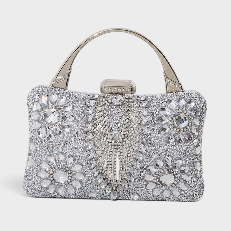 VALENORA silver crystal embellished clutch bag with floral gemstone patterns and a metallic top handle