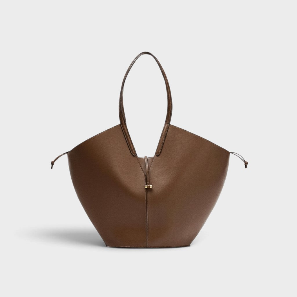 VALENORA Solene brown vegan leather tote bag with a sculptural wraparound handle and gold front toggle detail