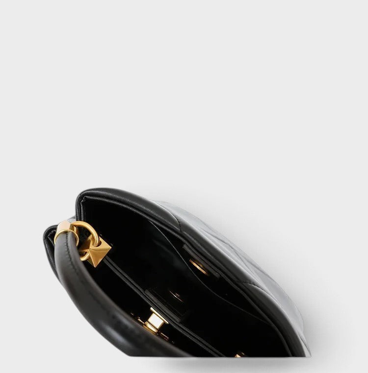 VALENORA Stella black genuine leather handbag with structured architectural design and gold hardware detail