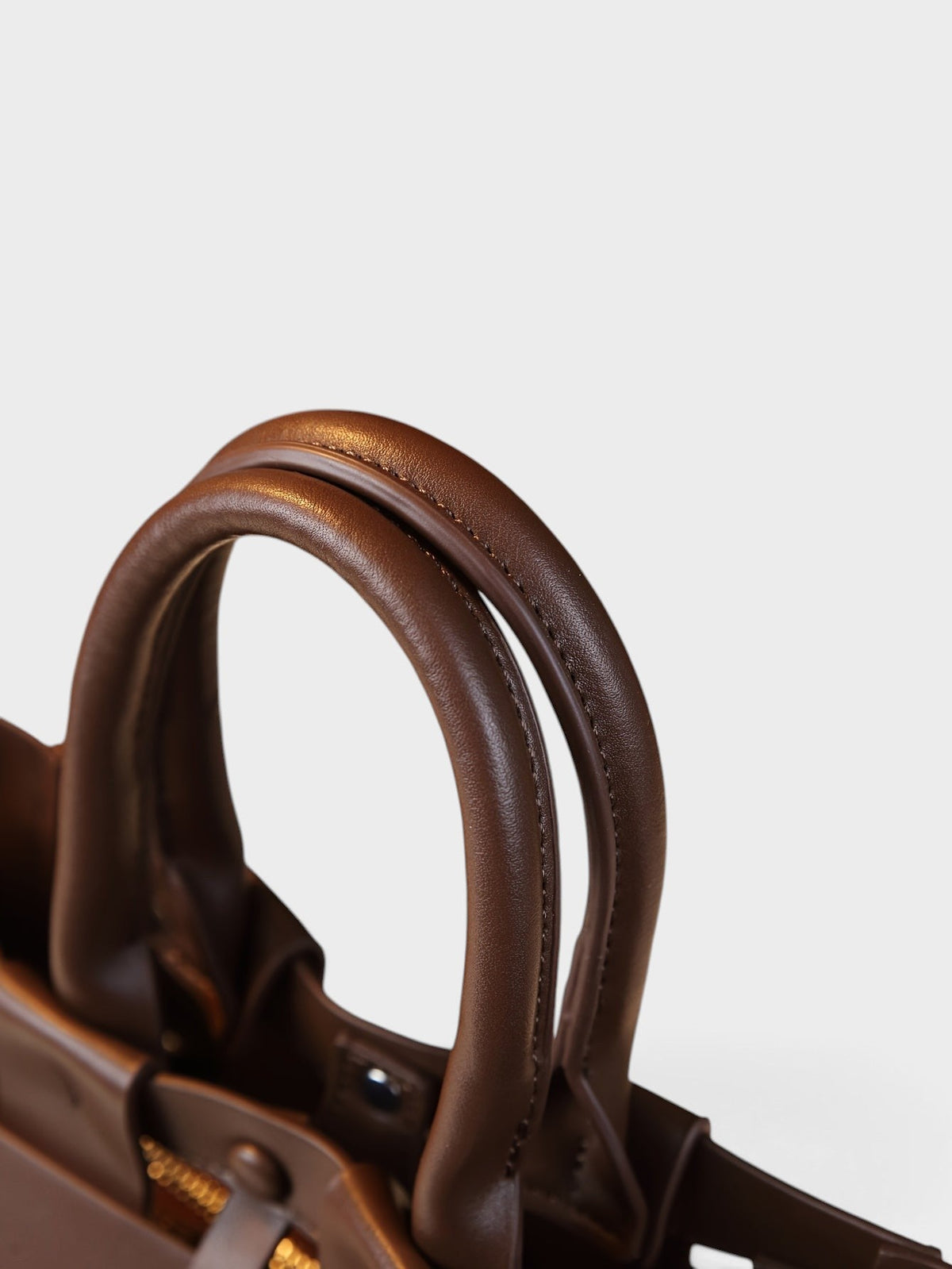 VALENORA Verona coffee brown genuine leather tote bag featuring sturdy stitched handles and vintage style details.