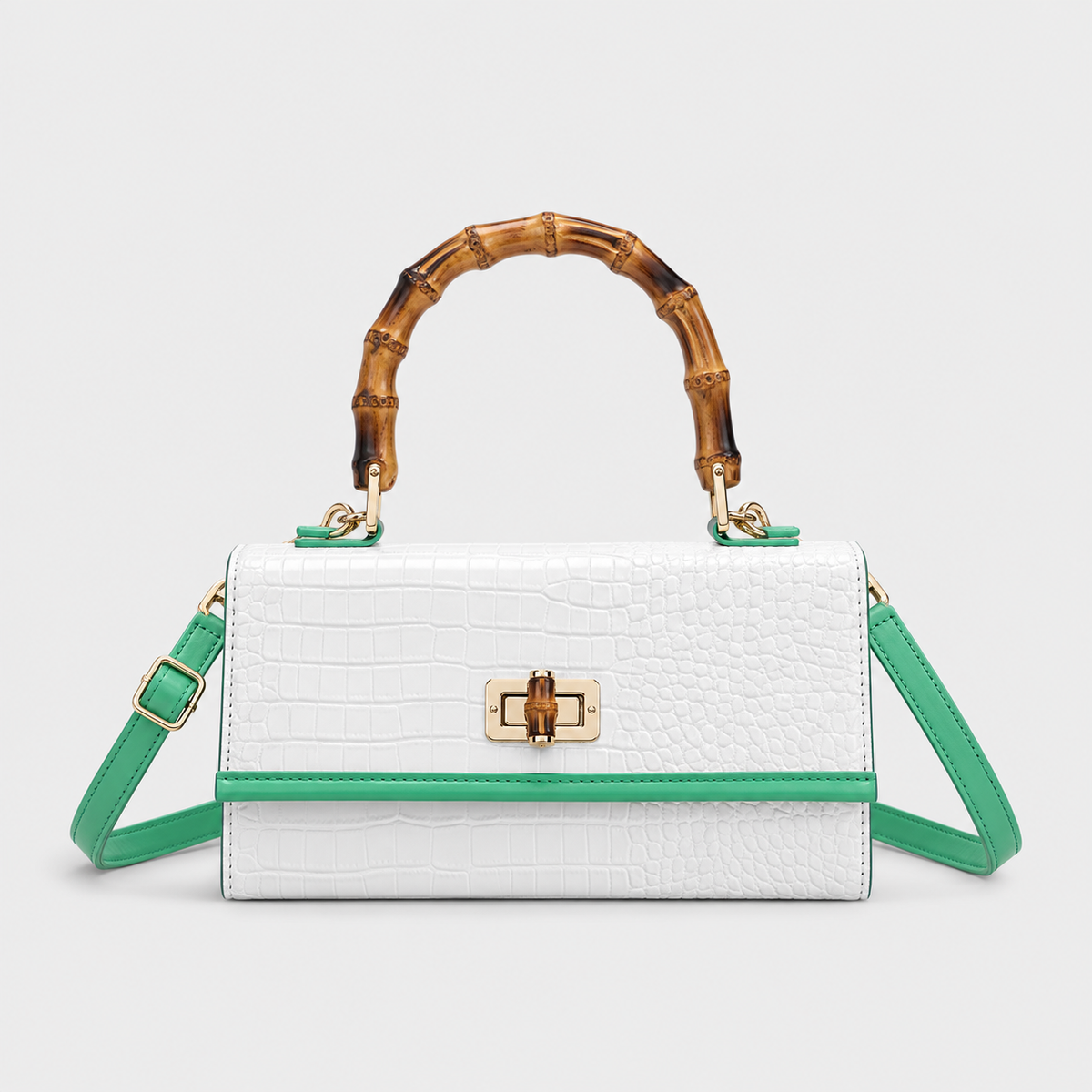 VALENORA white croc-embossed leather handbag with a bamboo-style handle and green trim accents.