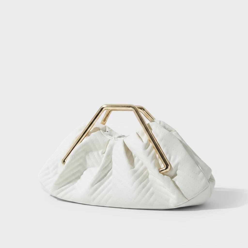 VALENORA Norah white vegan leather handbag with a herringbone pattern and gold-toned metal frame handle.