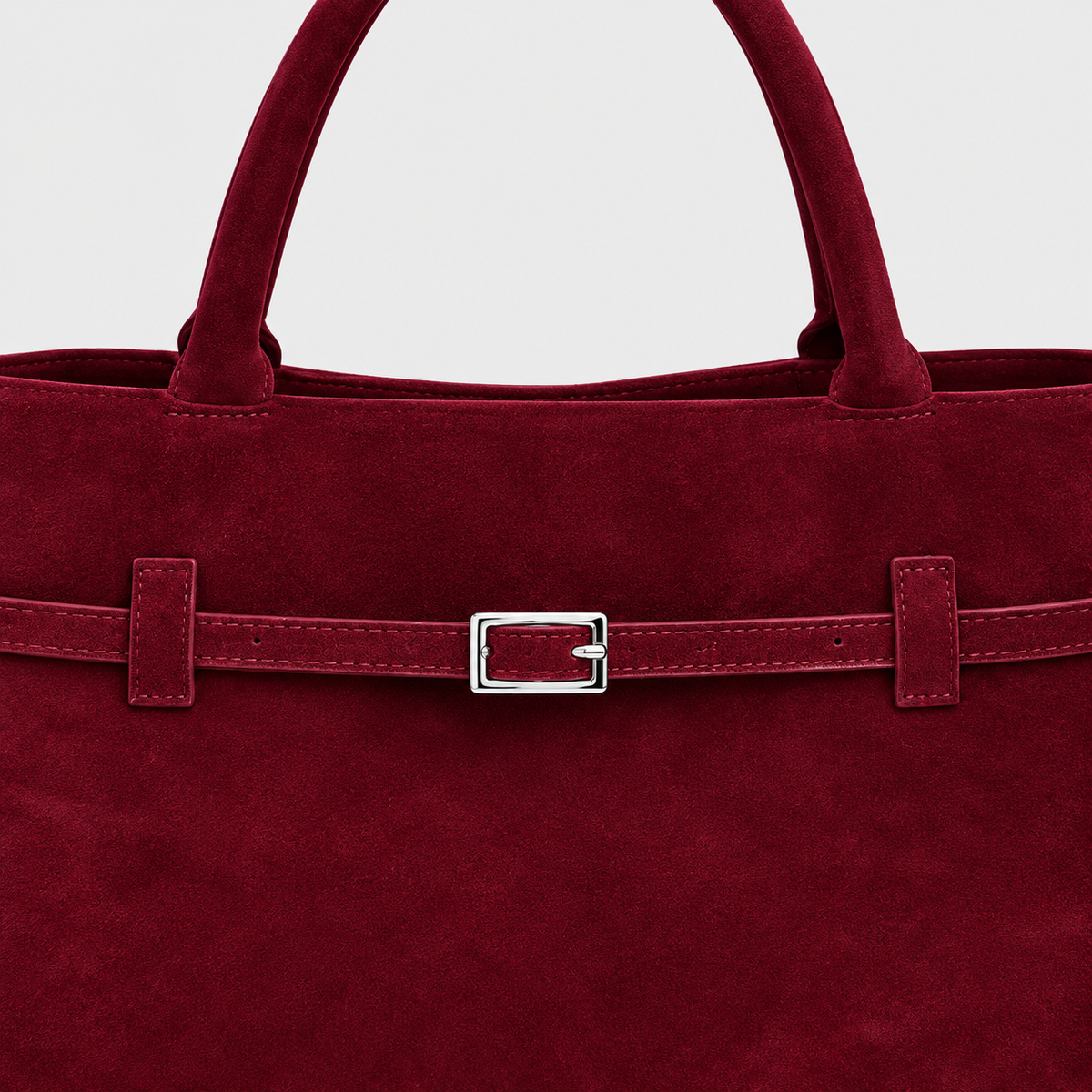 VALENORA Ramona wine red suede tote bag featuring a decorative slim belt strap with a polished silver buckle.