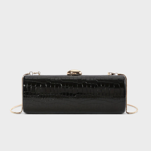 VALENORA Ysabel black croc-embossed vegan leather cylindrical clutch bag with a polished gold ball clasp and chain.