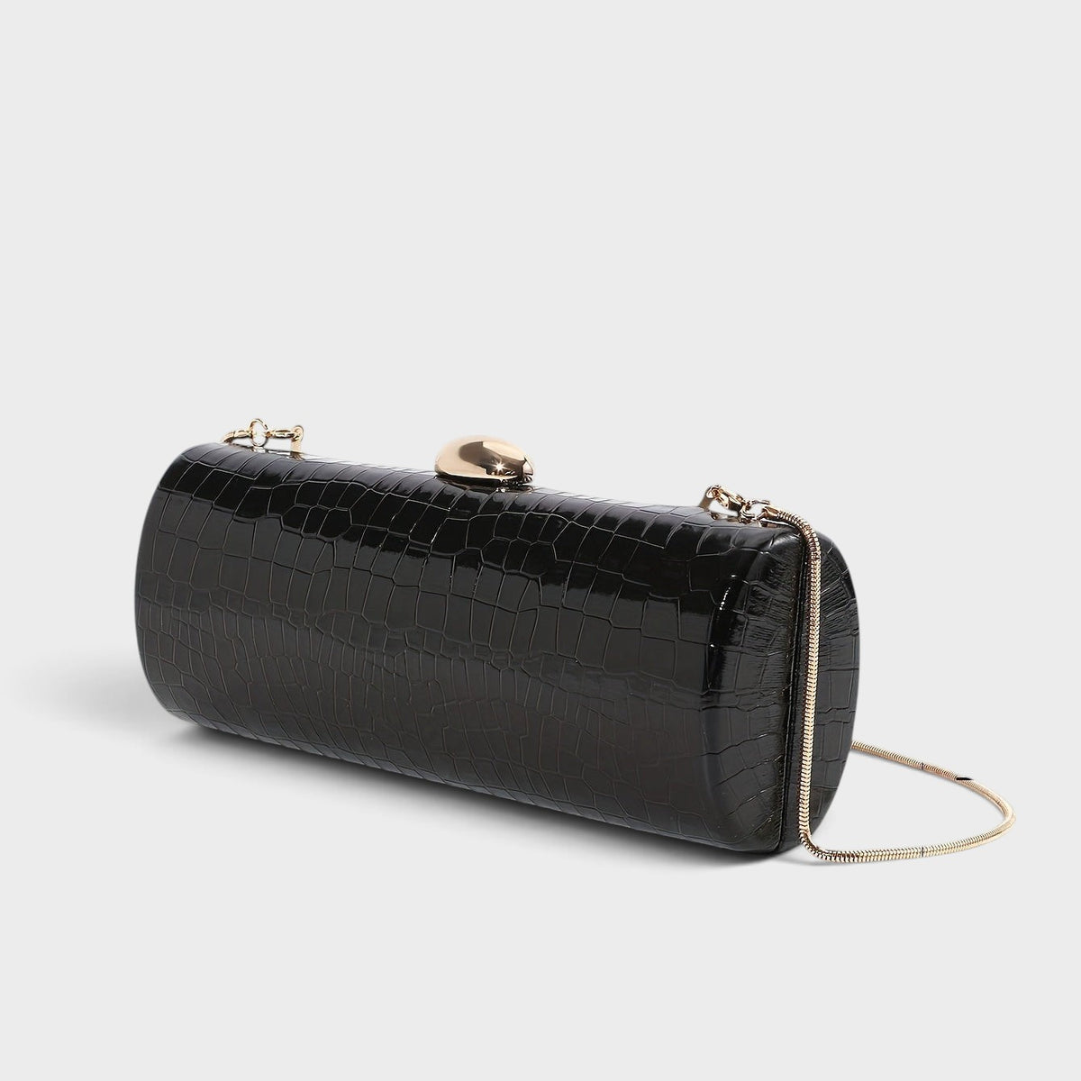 VALENORA Ysabel black croc-embossed vegan leather cylindrical clutch with a gold ball clasp and chain strap.